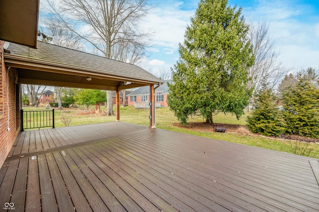 wooden deck with a yard