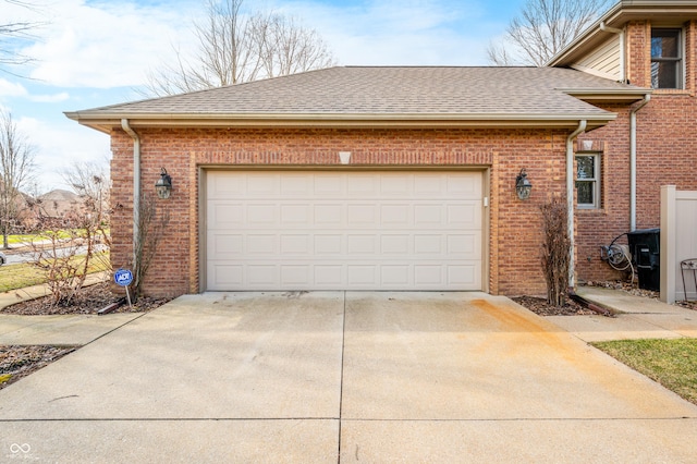 garage with concrete driveway