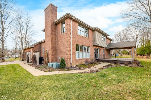 exterior space with driveway, a chimney, a lawn, and brick siding