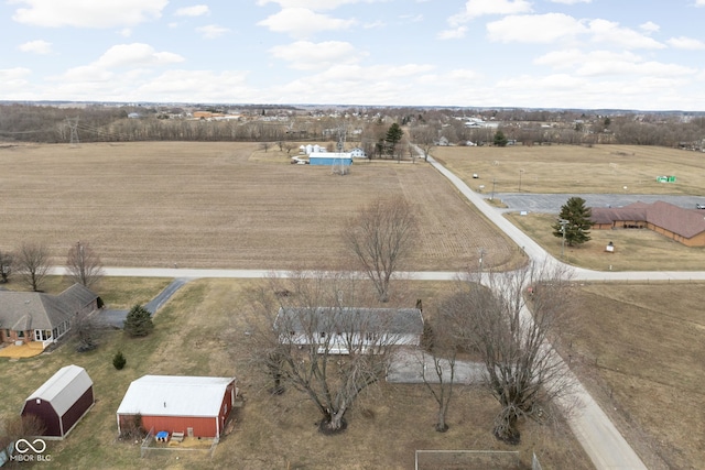 birds eye view of property featuring a rural view