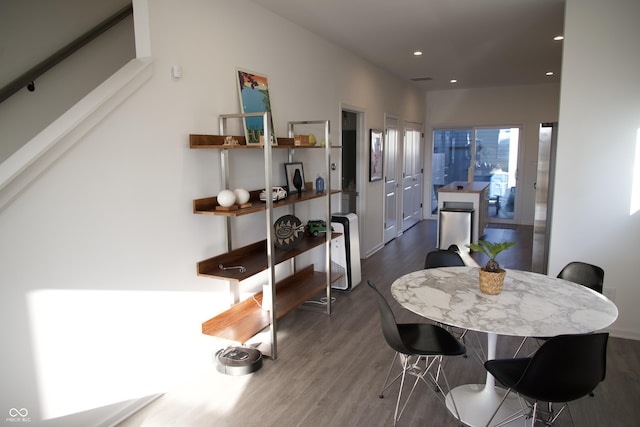 dining space with recessed lighting, stairway, and wood finished floors