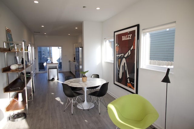 dining area with recessed lighting, baseboards, and wood finished floors