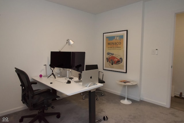 carpeted office featuring baseboards