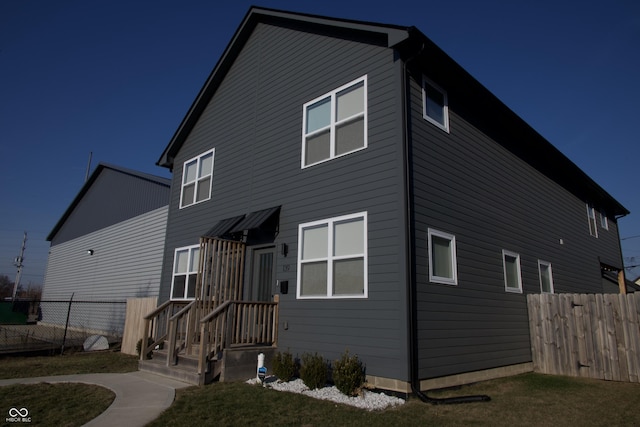 exterior space with a front yard and fence