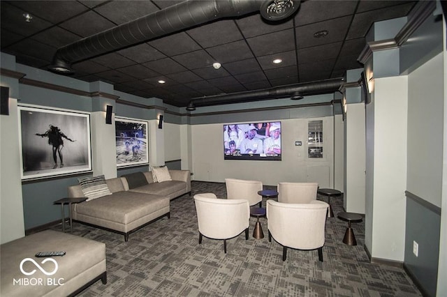 home theater room featuring baseboards and carpet floors