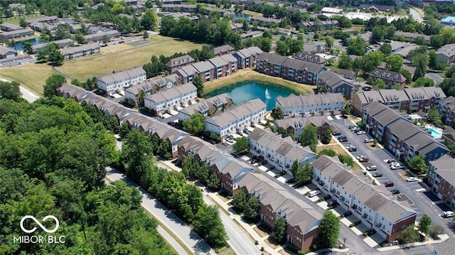 drone / aerial view featuring a residential view and a water view