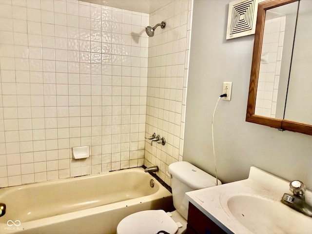 bathroom featuring toilet, visible vents, bathtub / shower combination, and vanity