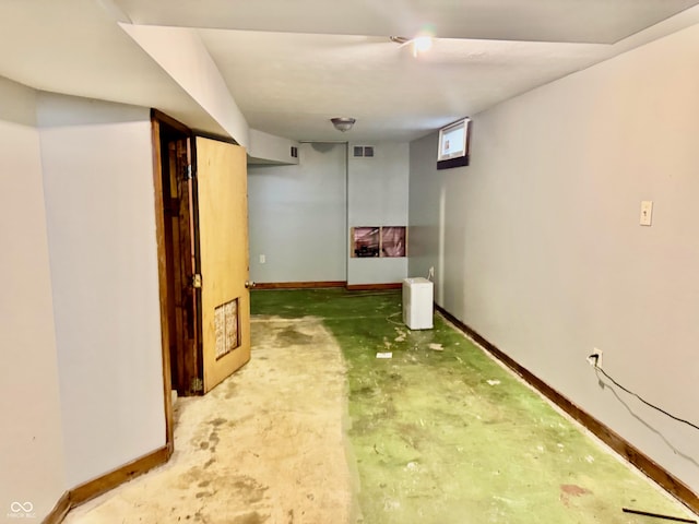 finished basement with visible vents and baseboards