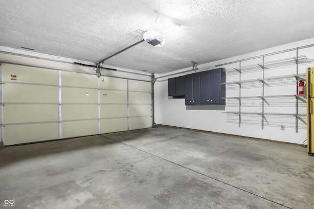 parking garage with baseboards and a garage door opener