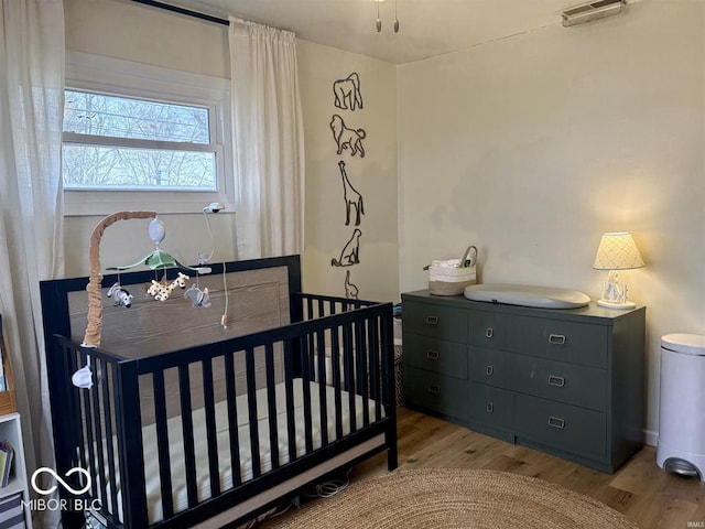 bedroom featuring light wood-type flooring