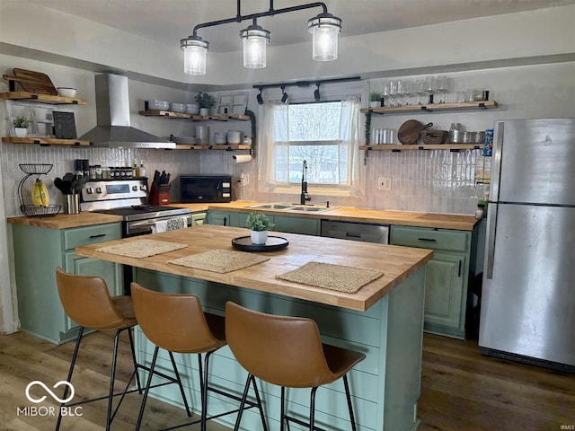 kitchen featuring stainless steel appliances, wood counters, and open shelves