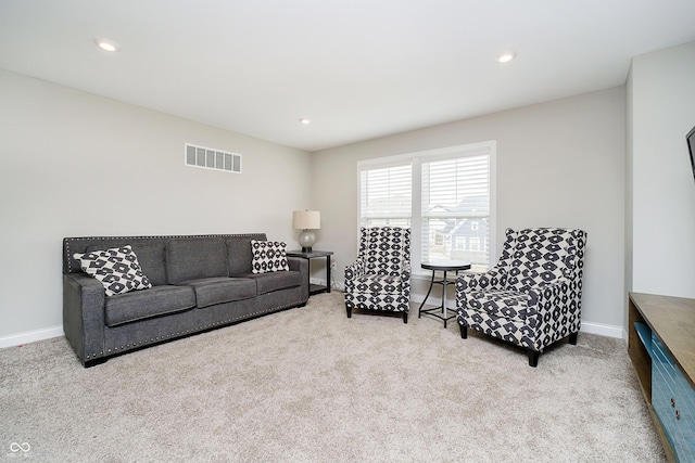 living area featuring recessed lighting, baseboards, visible vents, and carpet flooring