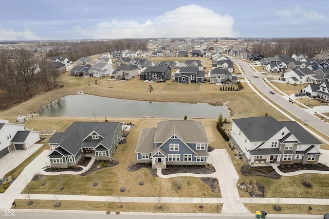 drone / aerial view featuring a residential view and a water view