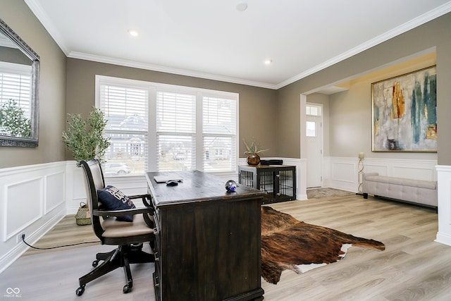 office space featuring ornamental molding, a healthy amount of sunlight, and wood finished floors