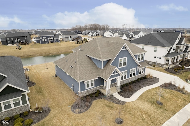 aerial view featuring a water view and a residential view