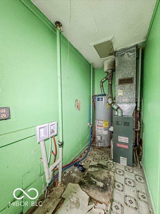 utility room featuring gas water heater