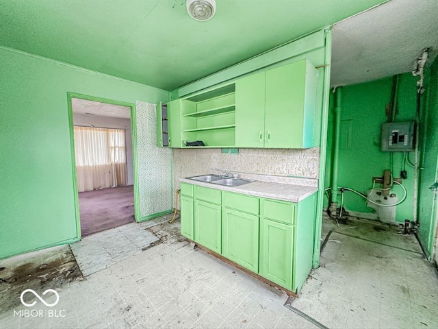 kitchen with open shelves, a sink, light countertops, electric panel, and light floors