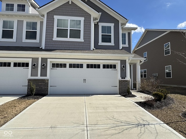 craftsman house with driveway and a garage