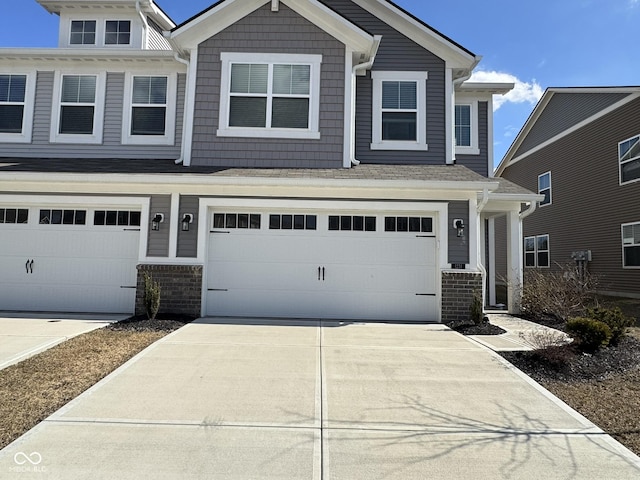 view of front of property with concrete driveway and an attached garage