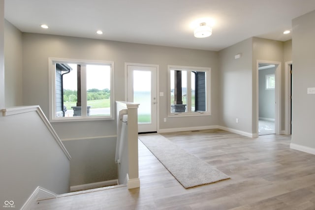 3604 Maple Ridge Dr, Columbus, IN 47201 - foyer with healthy amount of natural light, light wood finished floors, baseboards, and recessed lighting