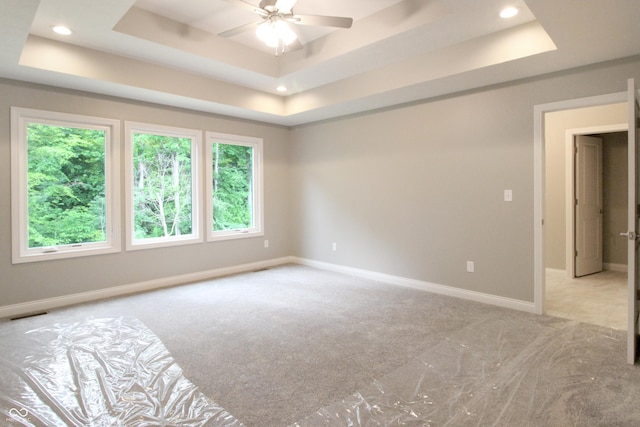 3604 Maple Ridge Dr, Columbus, IN 47201 - unfurnished bedroom with a tray ceiling, light carpet, baseboards, and recessed lighting