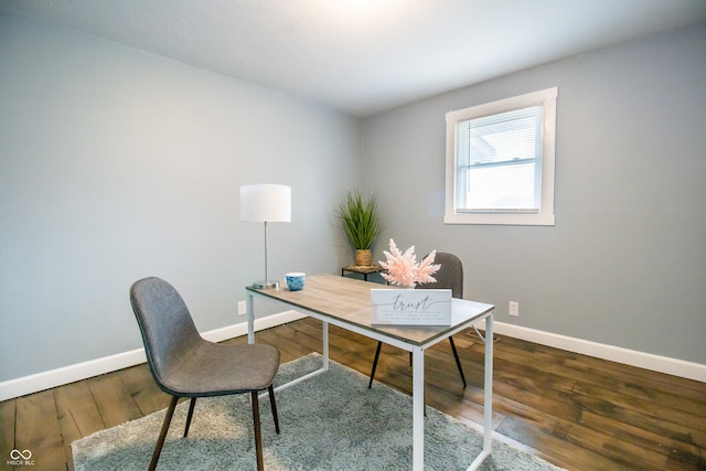 office space featuring hardwood / wood-style flooring and baseboards