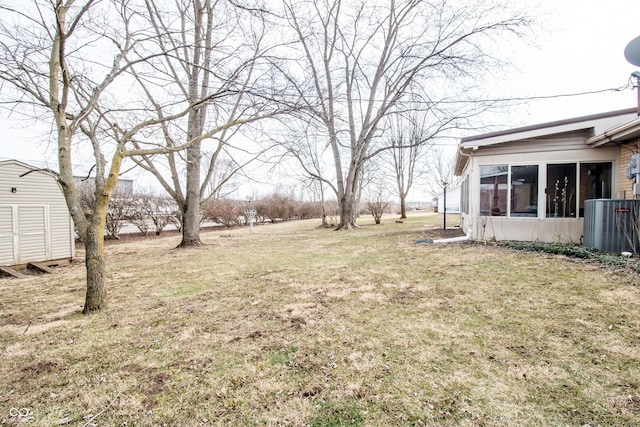 view of yard with an outdoor structure and a shed