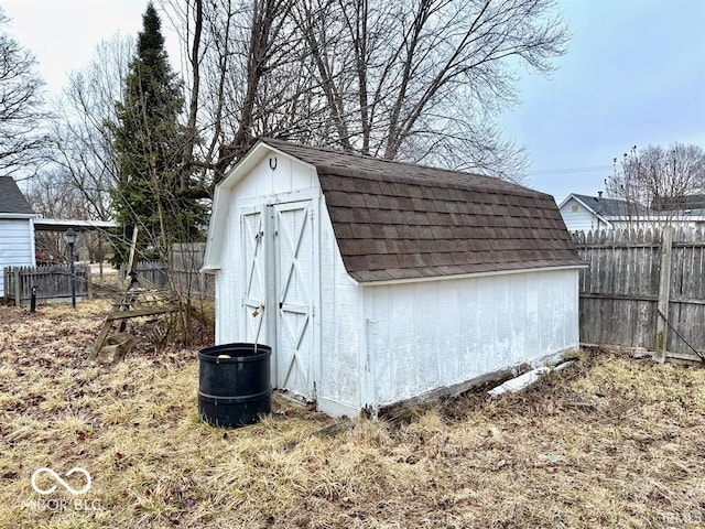 view of shed with fence