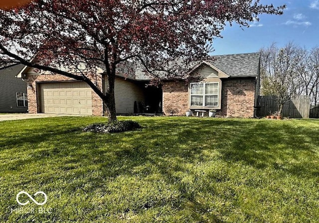 single story home with concrete driveway, a front lawn, and brick siding