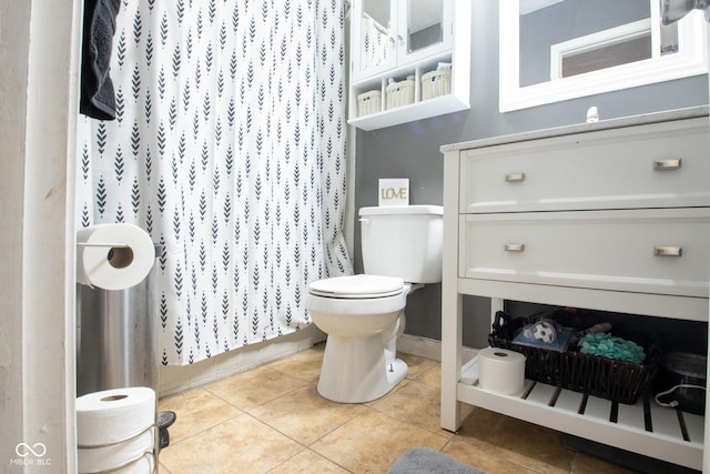 full bath featuring tile patterned flooring, curtained shower, and toilet