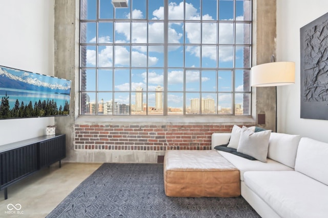 interior space with a healthy amount of sunlight, radiator, and a view of city