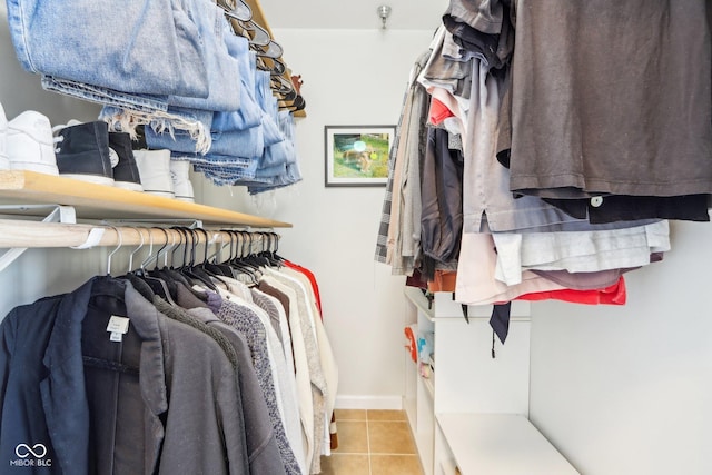 spacious closet featuring tile patterned flooring