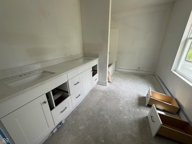 565 Mill Spgs, Coatesville, IN 46121 - bathroom featuring a bath, unfinished concrete flooring, and double vanity