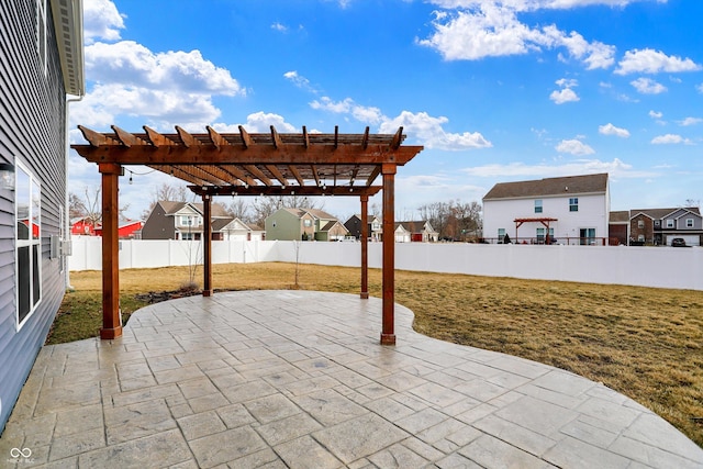 view of patio with a fenced backyard, a residential view, and a pergola