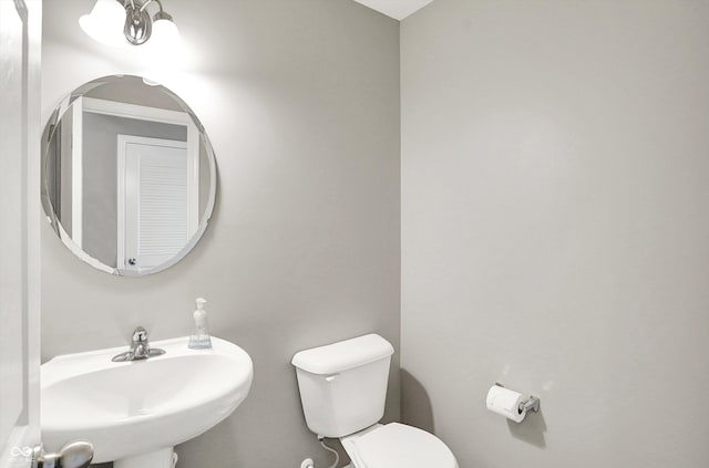 bathroom featuring a sink and toilet