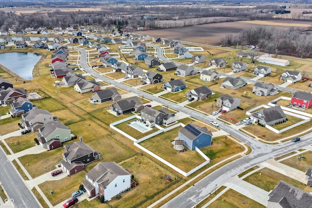 aerial view with a residential view and a water view