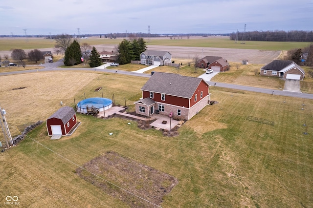 birds eye view of property featuring a rural view