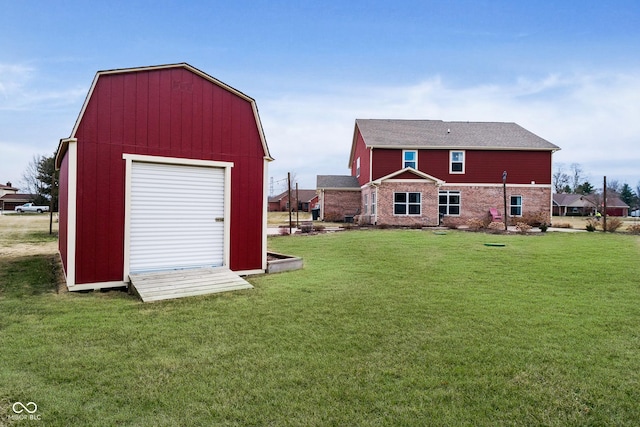 exterior space featuring an outdoor structure and a lawn