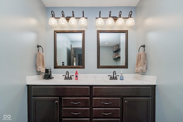 bathroom featuring double vanity and a sink