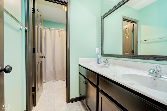 full bath featuring a sink and double vanity