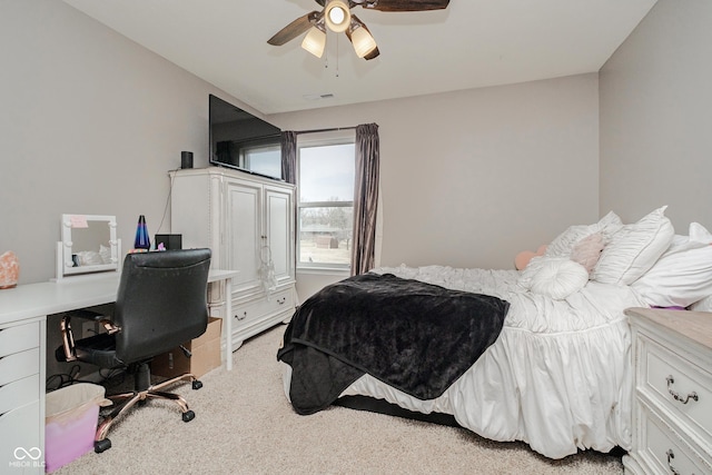 bedroom with light colored carpet and ceiling fan