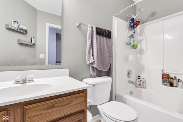 bathroom featuring toilet, shower / tub combination, and vanity