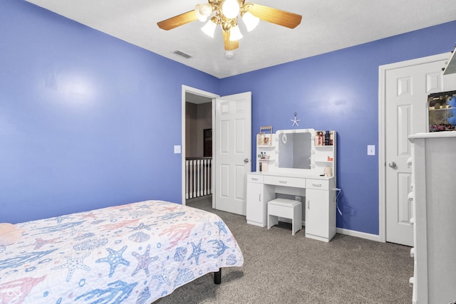 bedroom with ceiling fan, carpet floors, visible vents, and baseboards