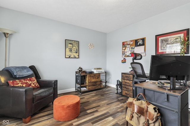 home office featuring dark wood-type flooring and baseboards