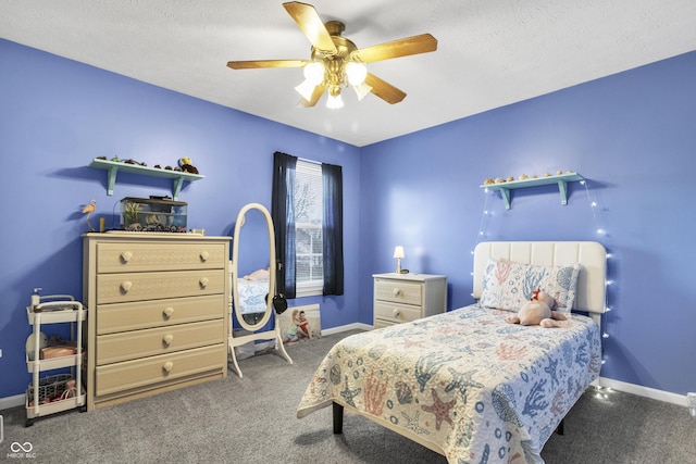 carpeted bedroom featuring a textured ceiling, baseboards, and a ceiling fan