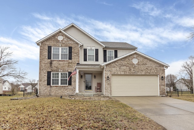 traditional-style home with driveway, brick siding, an attached garage, and fence