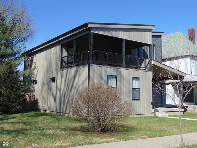 view of property exterior featuring a lawn