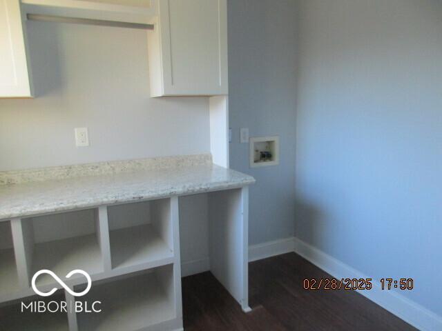 laundry room with washer hookup, dark wood-style flooring, and baseboards