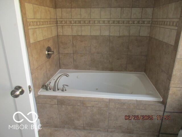 full bath with tiled tub