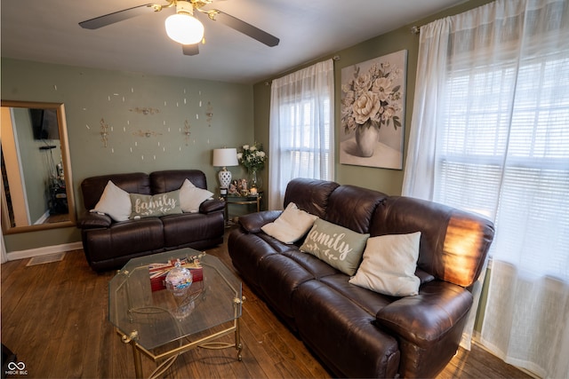 living area featuring ceiling fan, wood finished floors, and baseboards